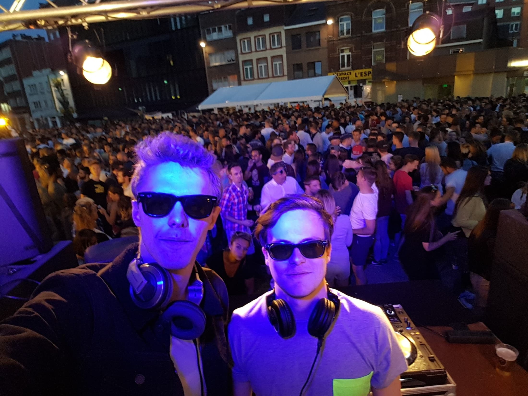 The Houseleggers DJs facing a massive crowd at an open-air event
